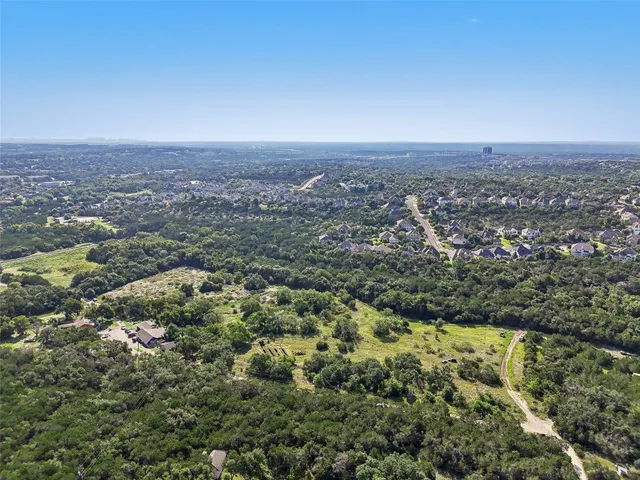 an aerial view of residential house and green space