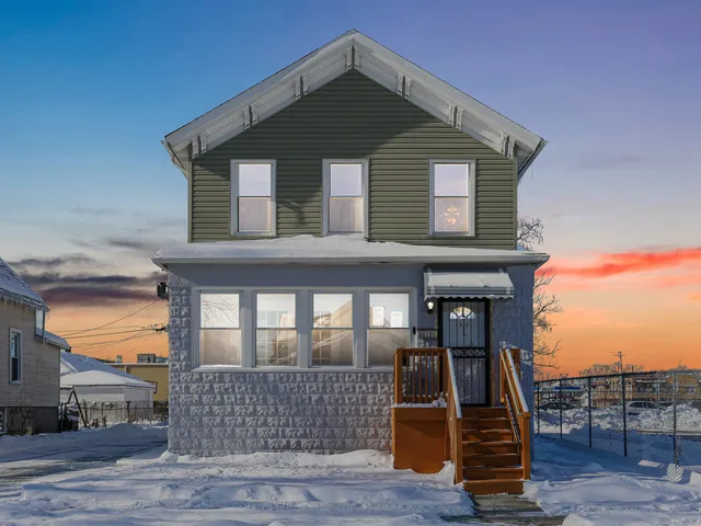 a front view of a house with glass windows