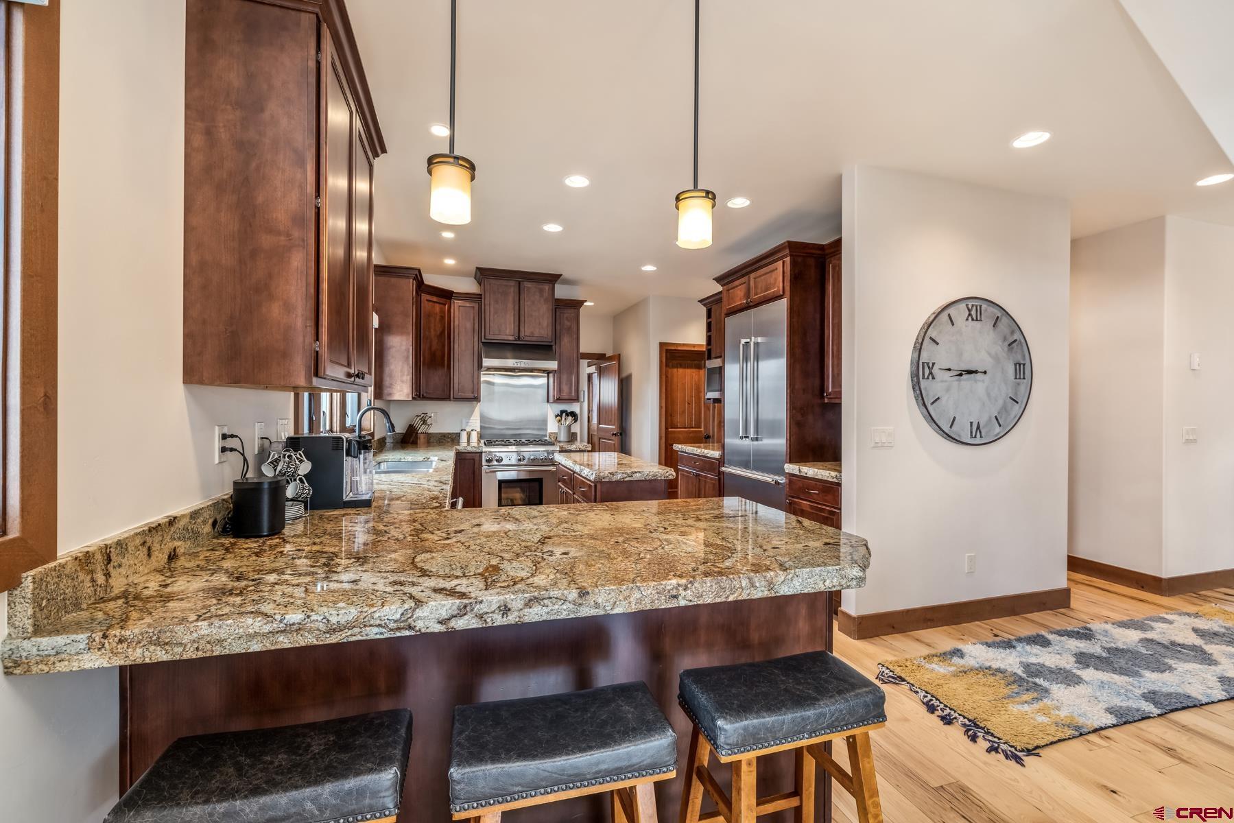 32 Cinnamon Mountain Road Crested Butte, CO 81225 - Photo 13 of 44 a kitchen with a table and chairs in it