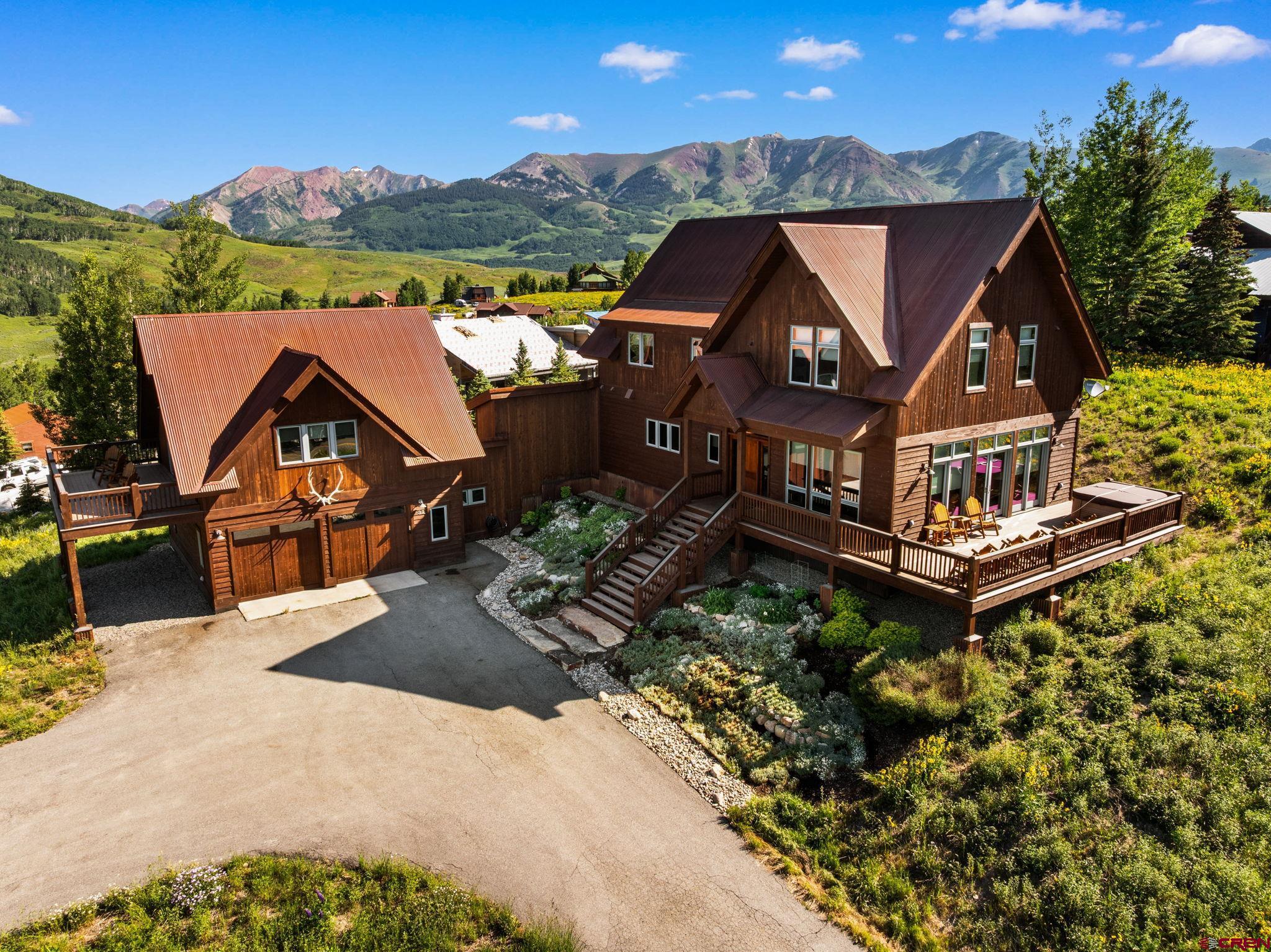 32 Cinnamon Mountain Road Crested Butte, CO 81225 - Photo 2 of 44 an aerial view of a house with a big yard