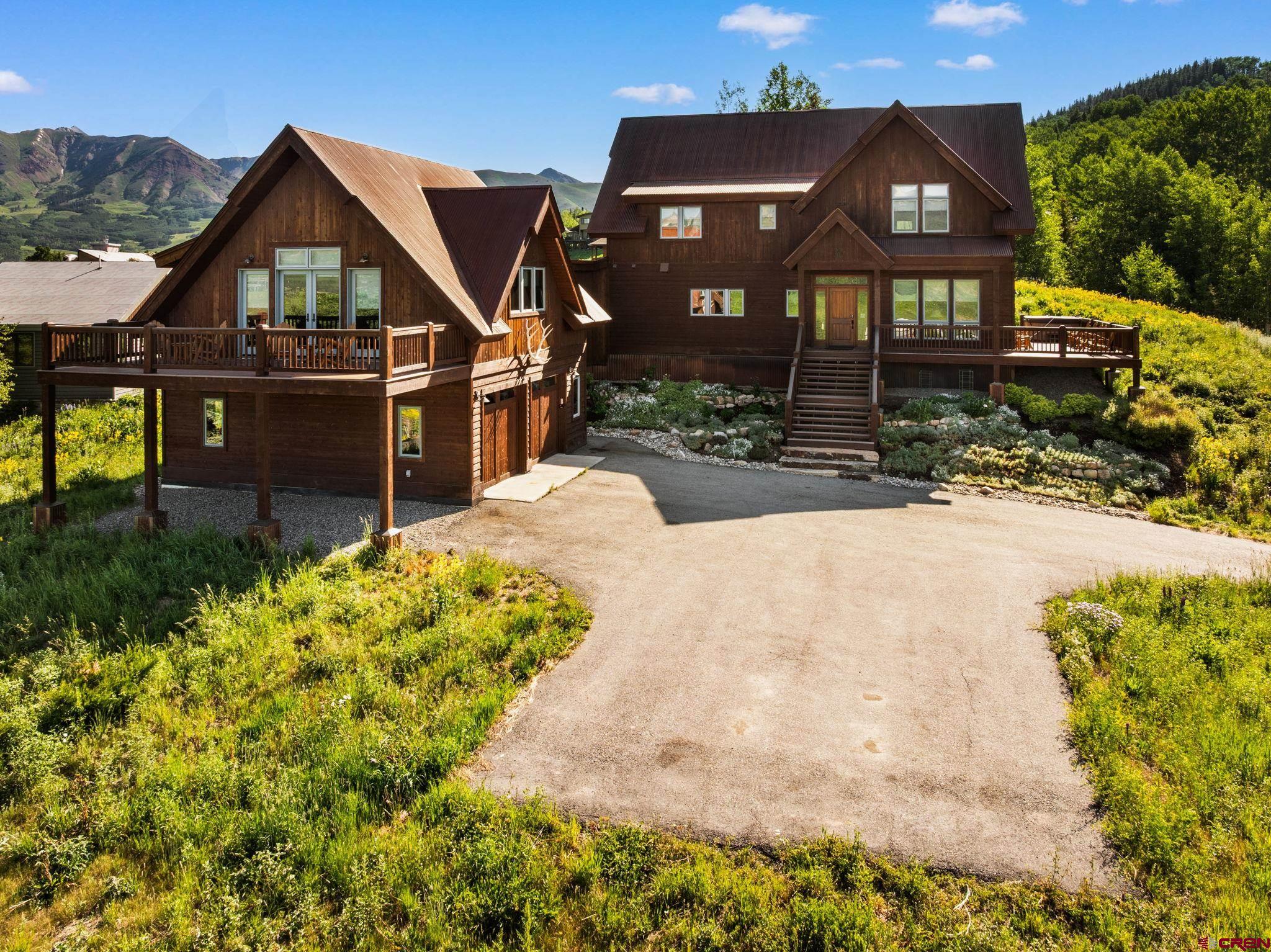 32 Cinnamon Mountain Road Crested Butte, CO 81225 - Photo 40 of 44 a front view of a house with a yard