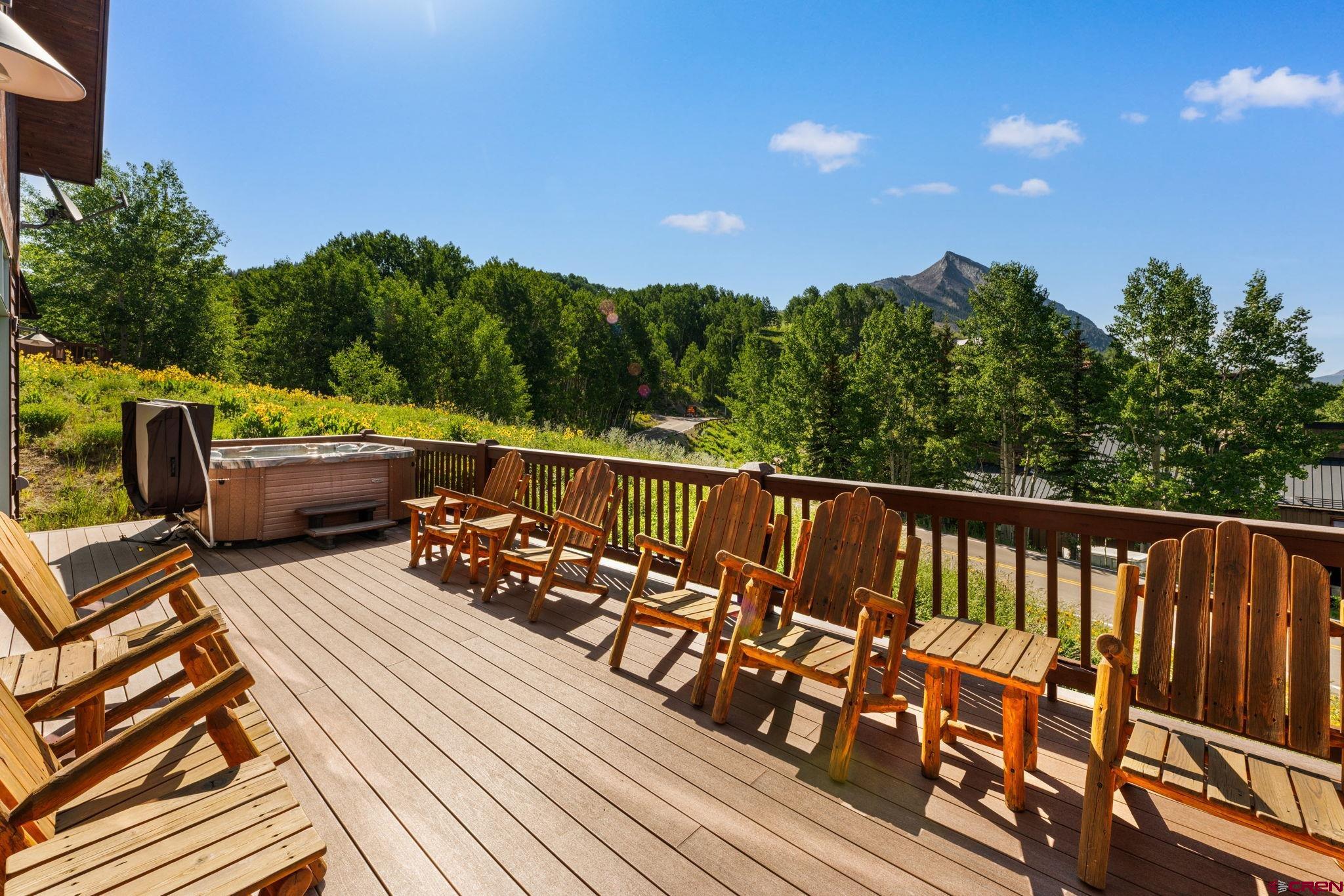32 Cinnamon Mountain Road Crested Butte, CO 81225 - Photo 10 of 44 a view of balcony with wooden floor and seating space