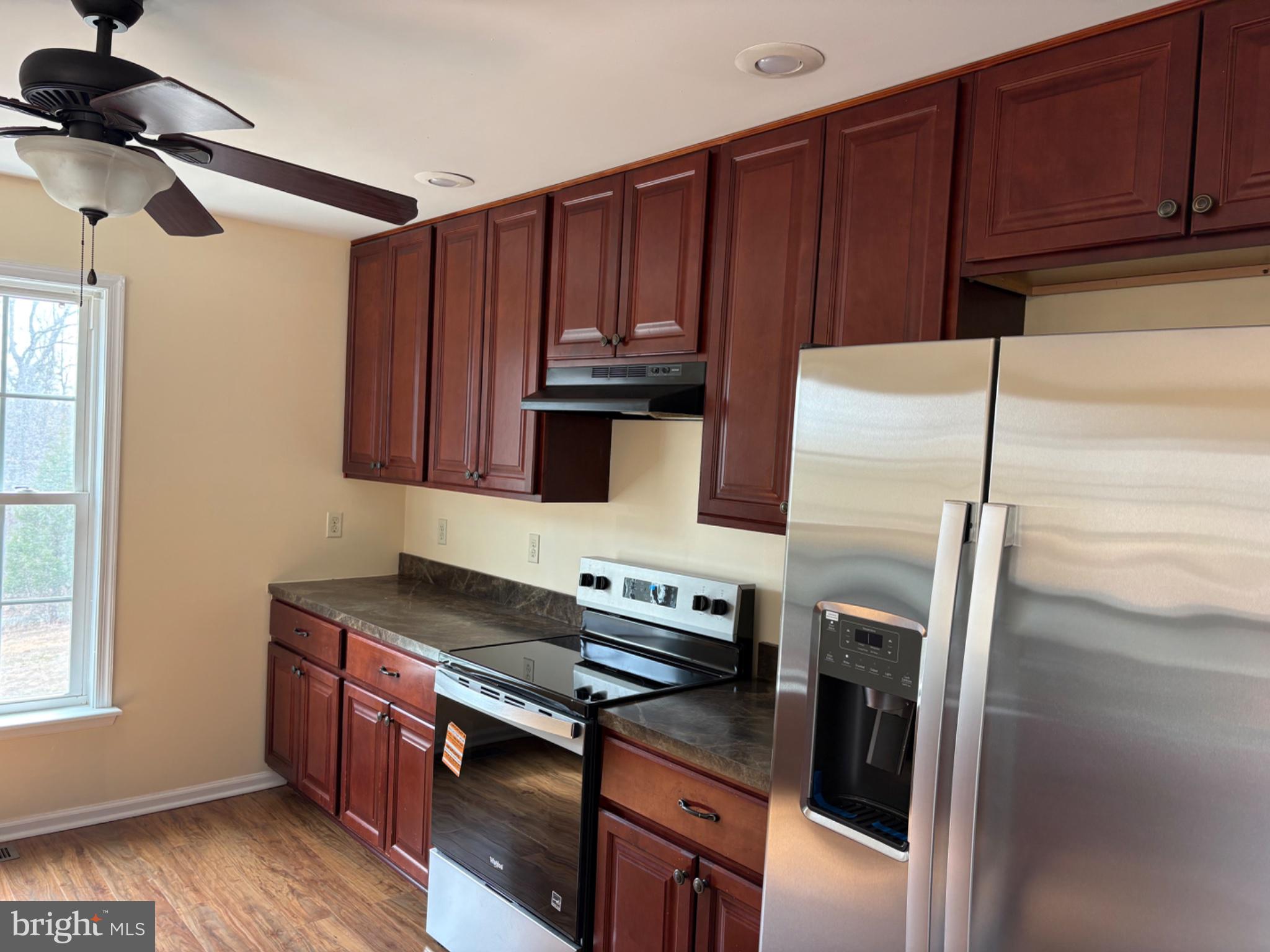 41 Elizabeth Lane Louisa, VA 23093 - Photo 7 of 19 Modern kitchen with rich cabinetry.