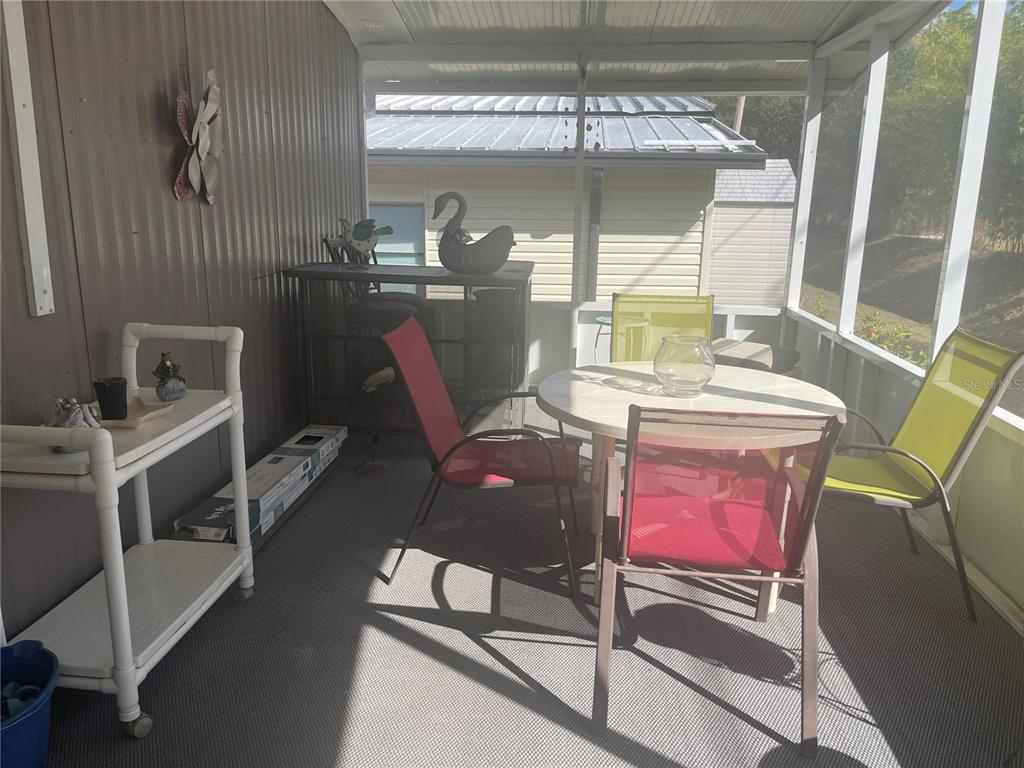 4179 Rolling Oaks Drive Winter Haven, FL 33880 - Photo 15 of 31 a view of a dining room with furniture window and outside view