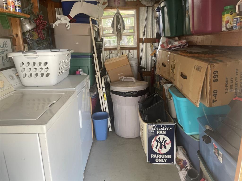 4179 Rolling Oaks Drive Winter Haven, FL 33880 - Photo 19 of 31 a close view of a sink a washer and dryer