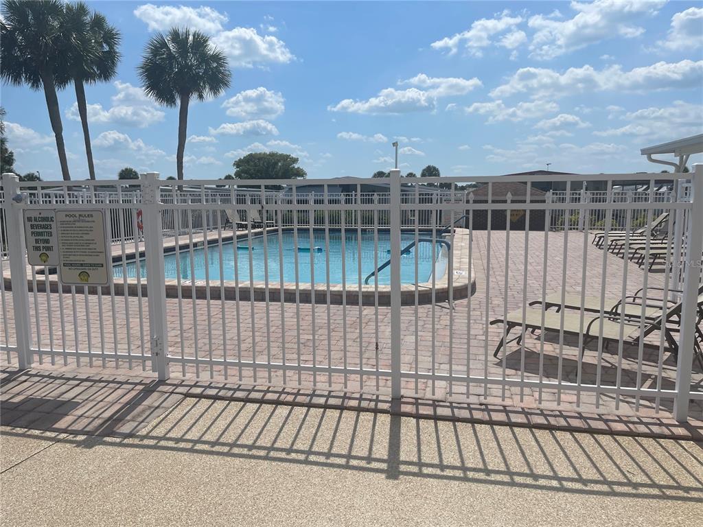 4179 Rolling Oaks Drive Winter Haven, FL 33880 - Photo 23 of 31 a view of balcony with wooden floor and fence