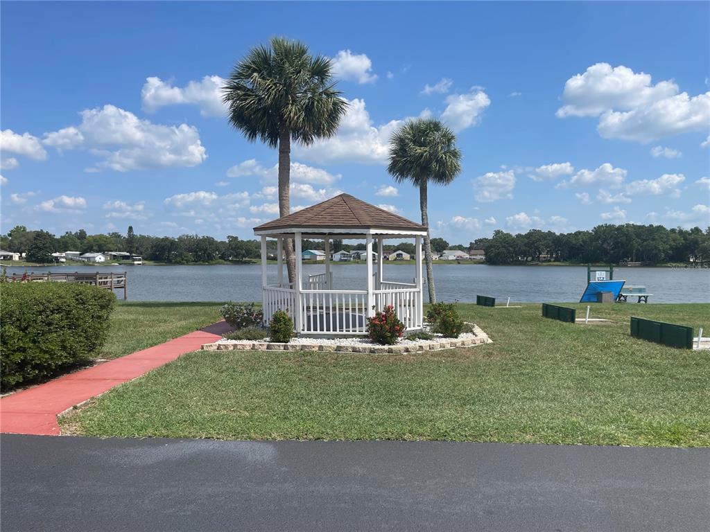 4179 Rolling Oaks Drive Winter Haven, FL 33880 - Photo 27 of 31 a house with garden in front of it
