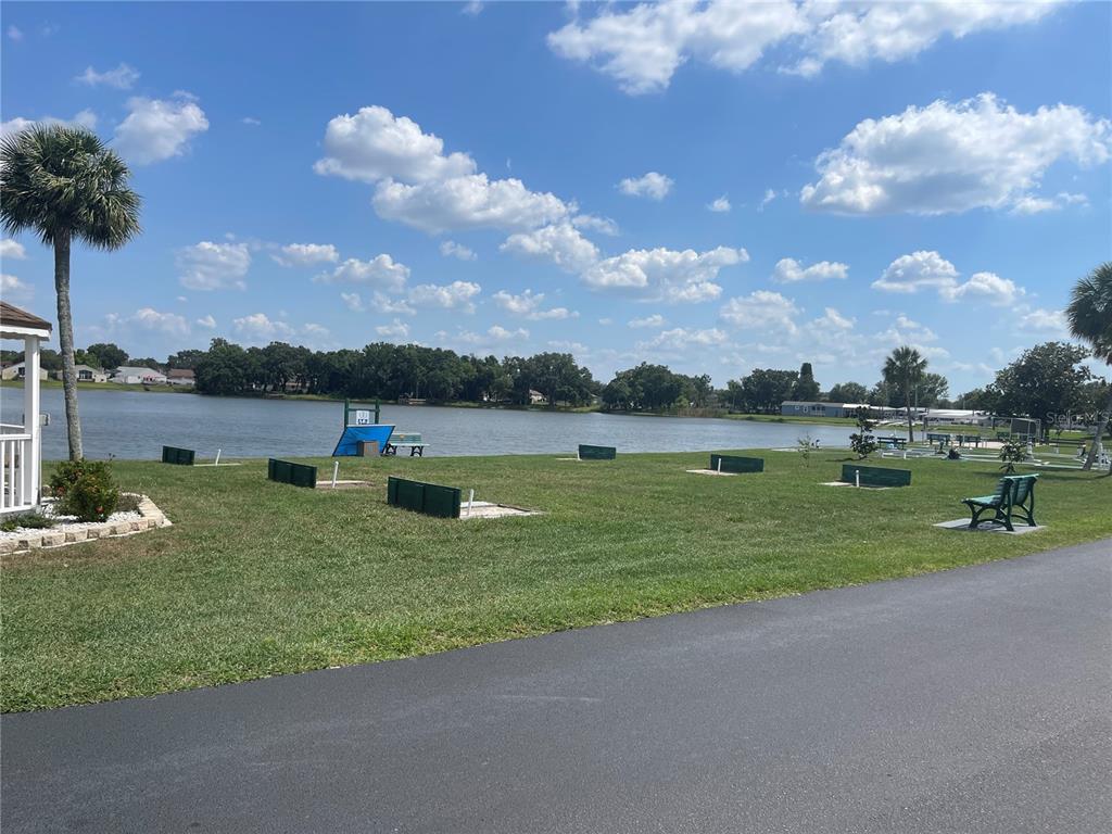 4179 Rolling Oaks Drive Winter Haven, FL 33880 - Photo 28 of 31 a view of a lake with houses in the back
