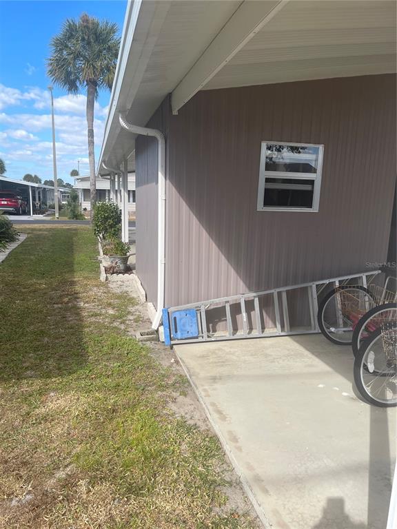 4179 Rolling Oaks Drive Winter Haven, FL 33880 - Photo 4 of 31 a view of a balcony with floor to ceiling window and outdoor space