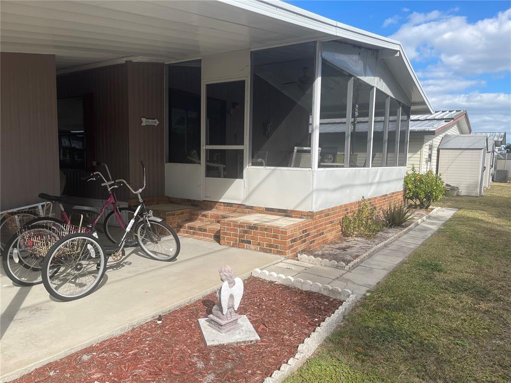 4179 Rolling Oaks Drive Winter Haven, FL 33880 - Photo 5 of 31 a front view of a house with garage