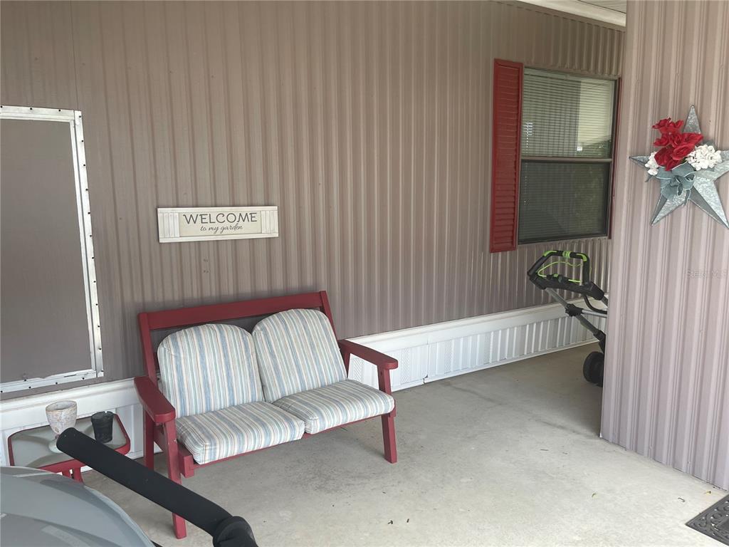 4179 Rolling Oaks Drive Winter Haven, FL 33880 - Photo 7 of 31 a living room with furniture and a potted plant