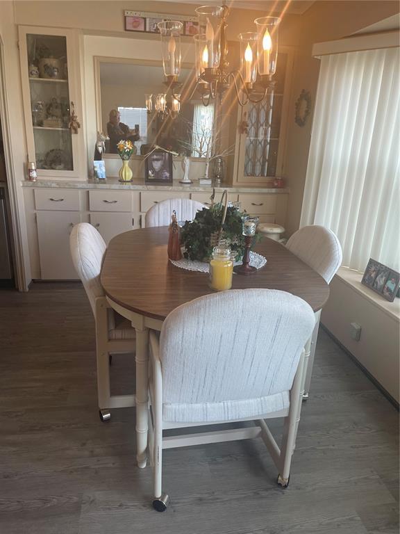 4179 Rolling Oaks Drive Winter Haven, FL 33880 - Photo 9 of 31 a view of a dining room with furniture and window