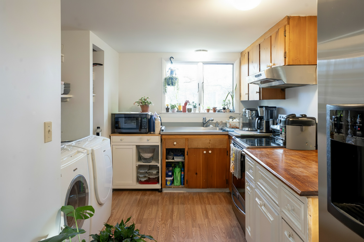 45 Quenames Road Chilmark, MA 02535 - Photo 2 of 13 a kitchen with stainless steel appliances a stove a sink and a microwave