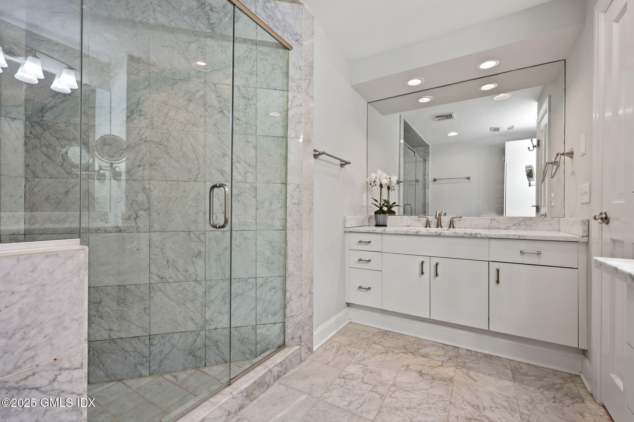 333 Palmer Hill Road, Unit 2E Riverside, CT 06878 - Photo 13 of 21 a spacious bathroom with a shower sink and mirror