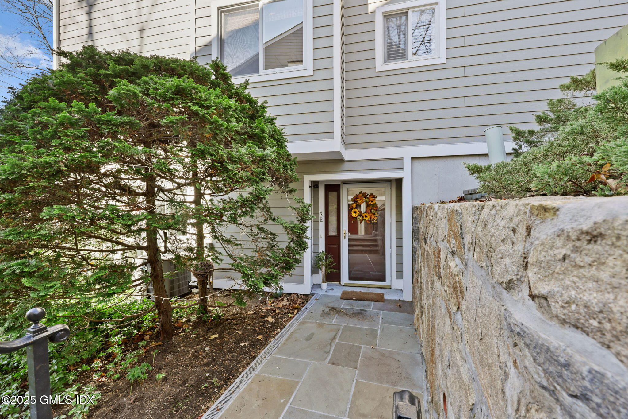 333 Palmer Hill Road, Unit 2E Riverside, CT 06878 - Photo 14 of 21 a view of a house with a tree