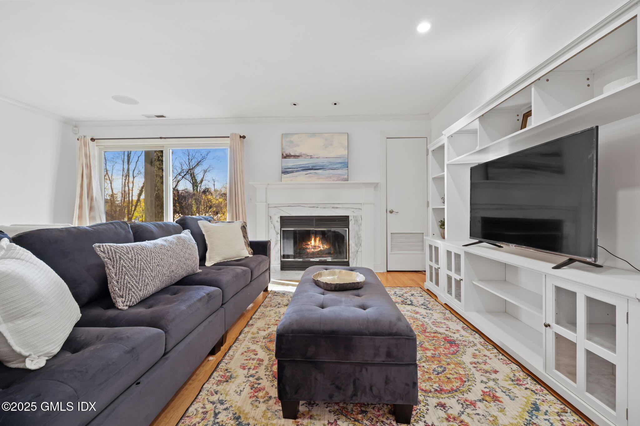 333 Palmer Hill Road, Unit 2E Riverside, CT 06878 - Photo 4 of 21 a living room with furniture and a flat screen tv