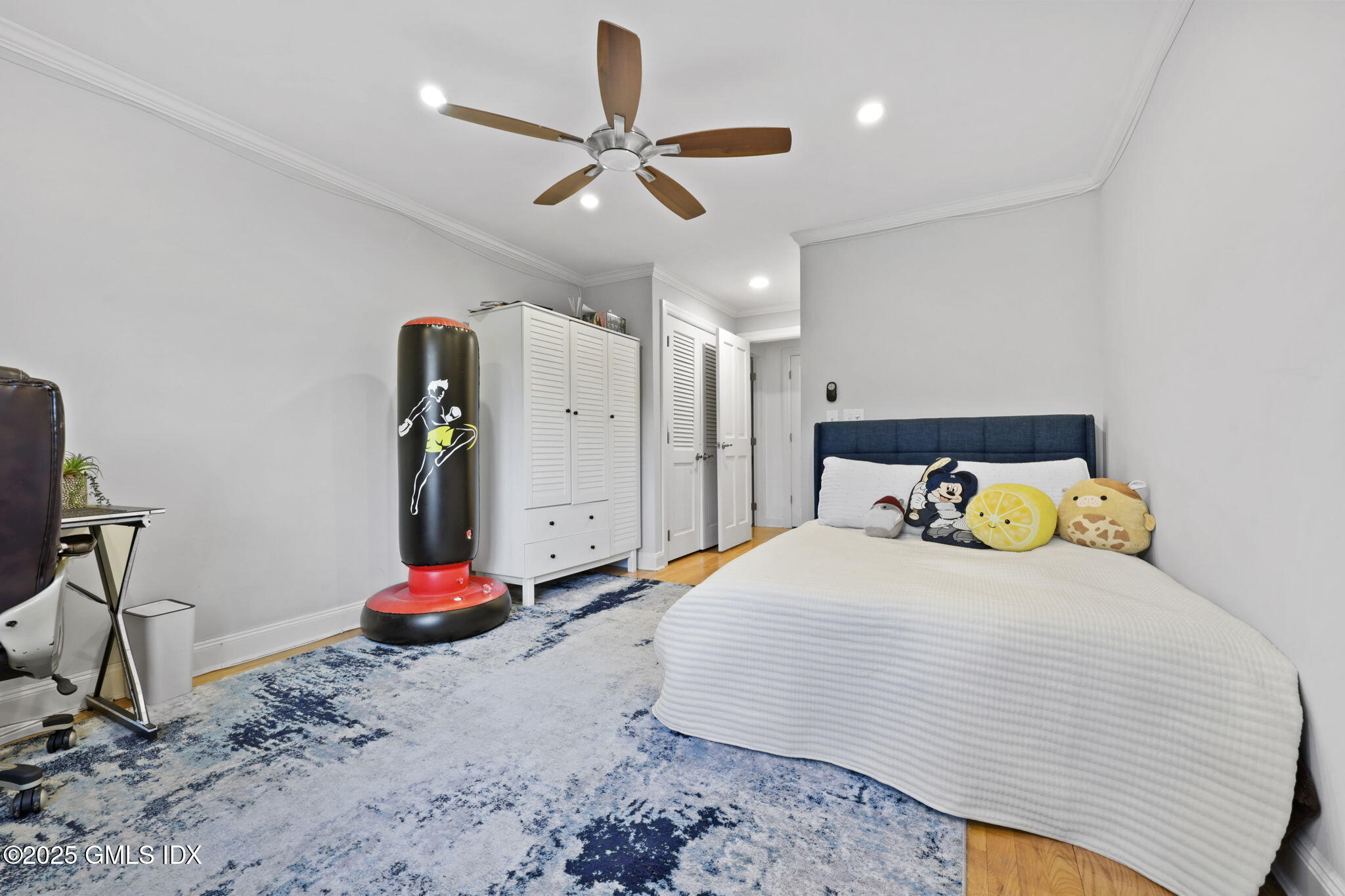 333 Palmer Hill Road, Unit 2E Riverside, CT 06878 - Photo 10 of 21 a bedroom with a bed and a chandelier