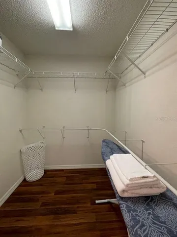 a view of room with racks on the wall