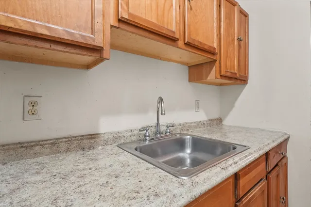 a kitchen with a sink and cabinets