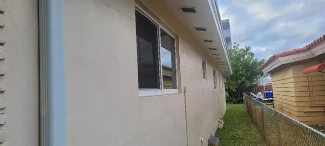 a backyard of a house with lots of green space