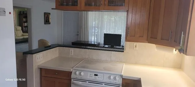 a kitchen with a sink and a microwave