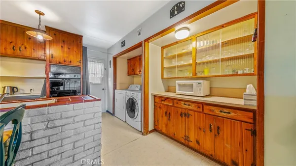 a kitchen with stainless steel appliances a stove and a microwave oven