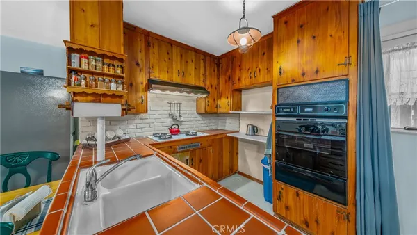 a kitchen that has a table and chairs in it