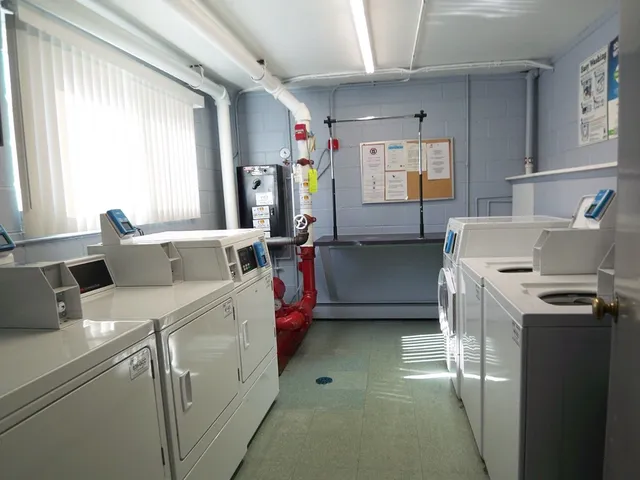 a utility room with cabinets washer and dryer