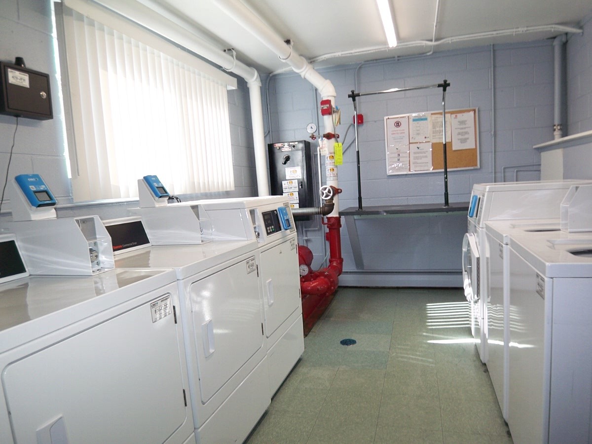 1227 South Old Wilke Road, Unit 306 Rolling Meadows, IL 60005 - Photo 20 of 24 a utility room with cabinets washer and dryer