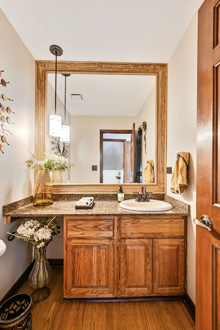 1435 Tomlin Drive Burr Ridge, IL 60527 - Photo 11 of 41 a kitchen with a sink stove and cabinets