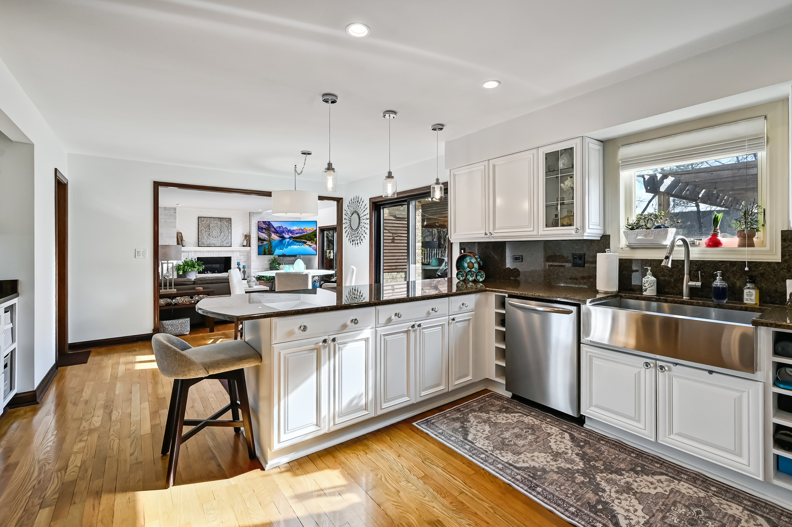 1435 Tomlin Drive Burr Ridge, IL 60527 - Photo 12 of 41 a kitchen with stainless steel appliances granite countertop a stove top oven a sink dishwasher and cabinets with wooden floor