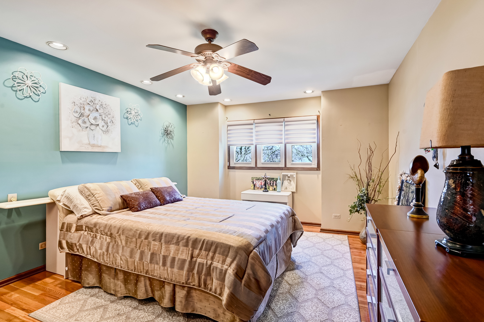 1435 Tomlin Drive Burr Ridge, IL 60527 - Photo 24 of 41 a bedroom with a bed and wooden floor