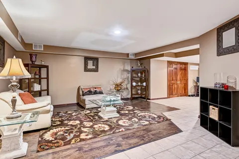 a living room with furniture window and wooden floor