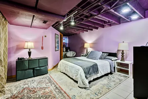 a bed room with a bed and a mirror