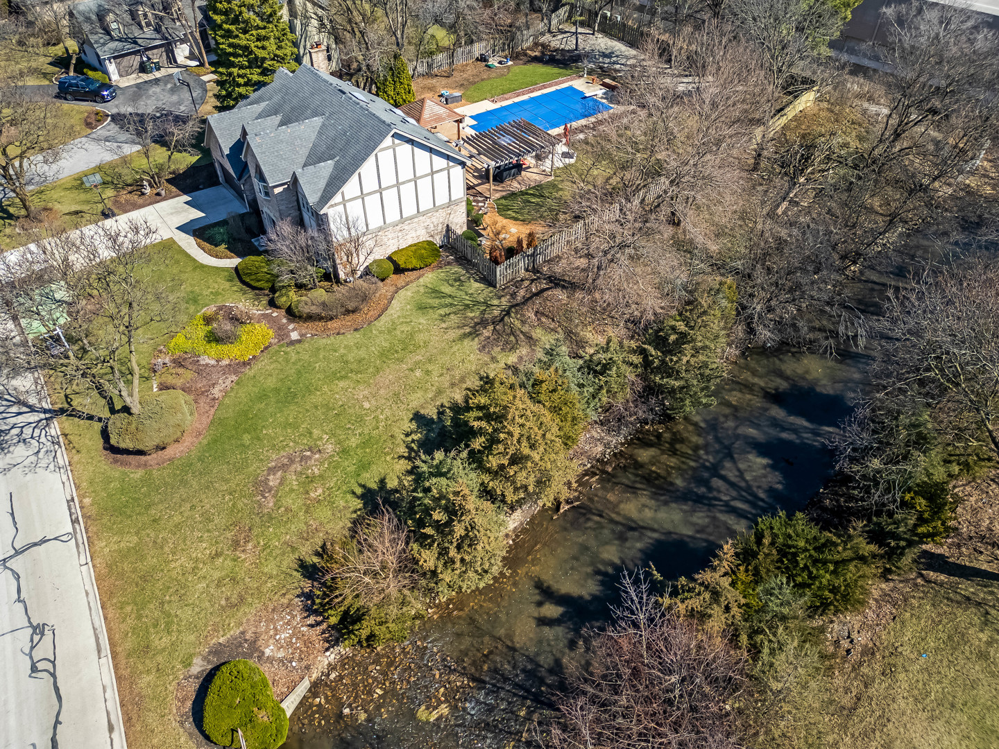 1435 Tomlin Drive Burr Ridge, IL 60527 - Photo 34 of 41 a aerial view of a house with swimming pool and large trees