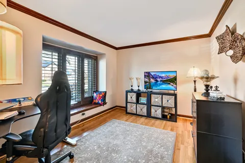 a bedroom with furniture and a window