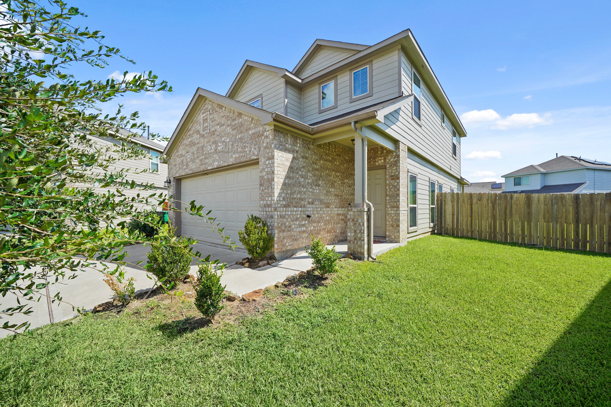 13303 Ardery Meadow Drive Houston, TX 77048 - Photo 2 of 33 a front view of a house with yard and green space