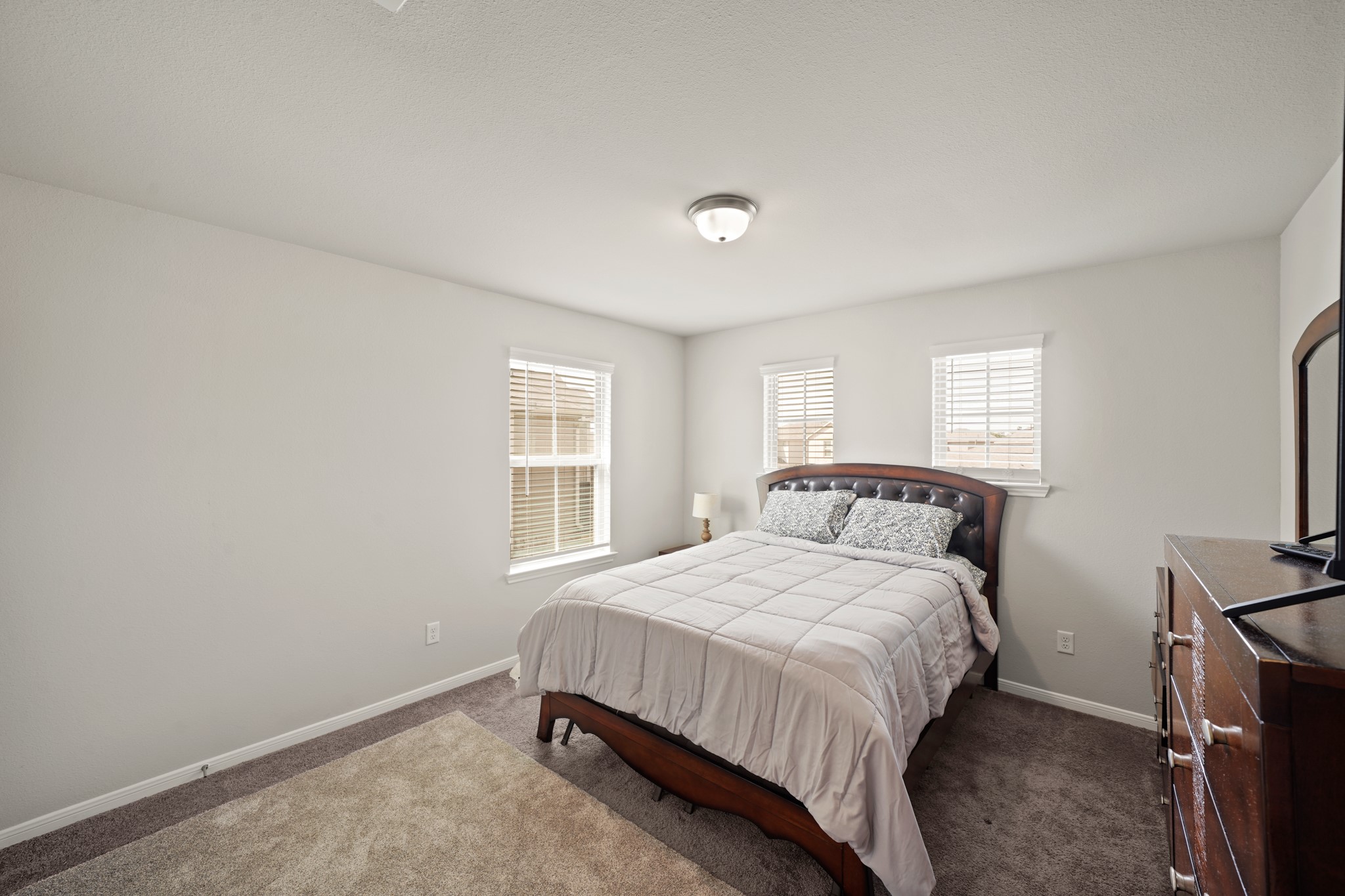 13303 Ardery Meadow Drive Houston, TX 77048 - Photo 27 of 33 a bedroom with a bed and a window