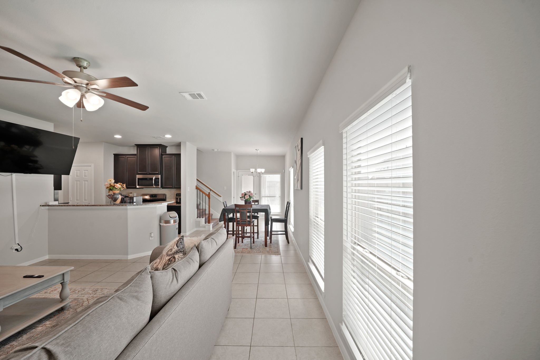 13303 Ardery Meadow Drive Houston, TX 77048 - Photo 3 of 33 a view of a dining room with furniture window and wooden floor