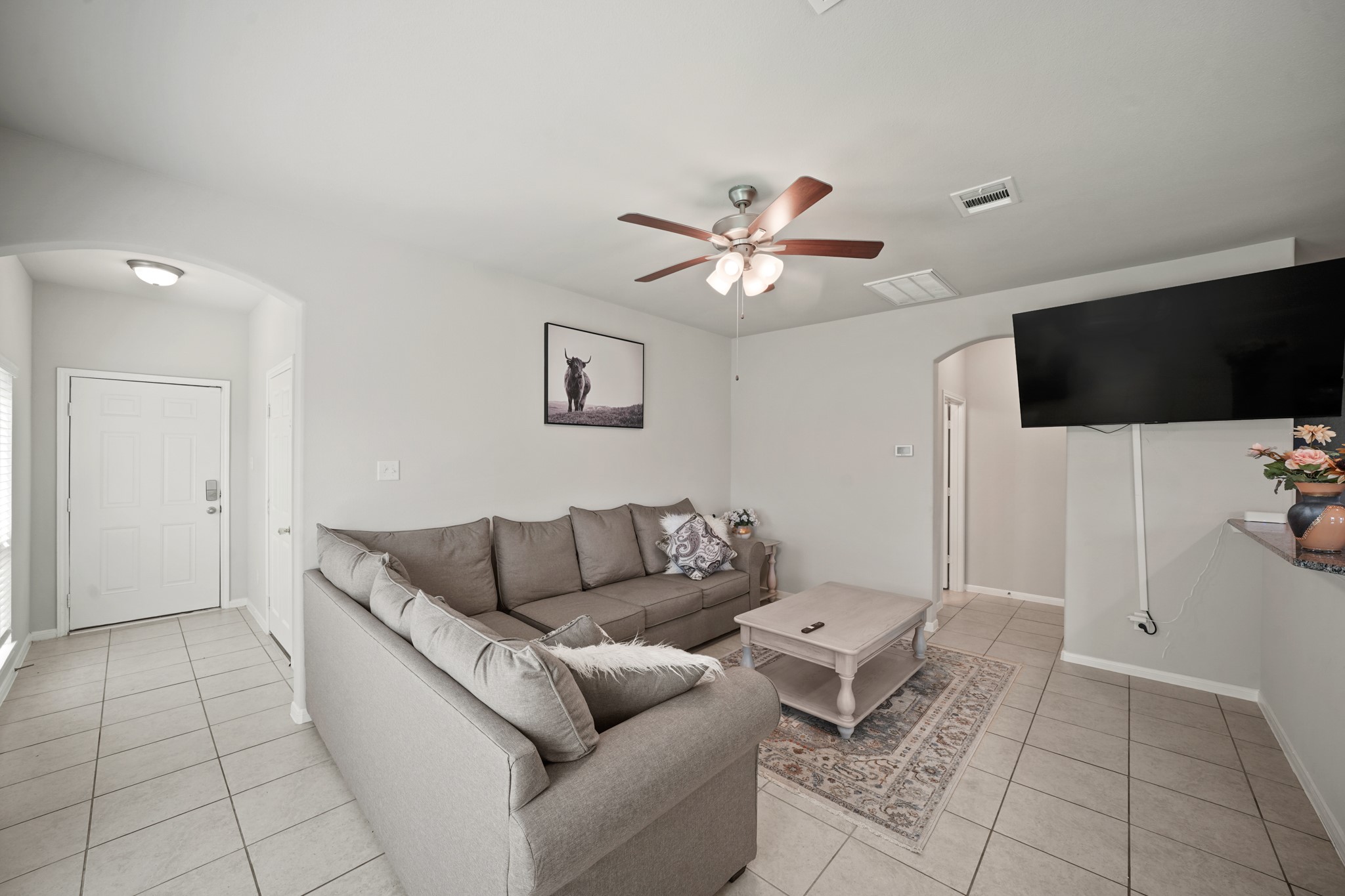 13303 Ardery Meadow Drive Houston, TX 77048 - Photo 5 of 33 a living room with furniture and a flat screen tv