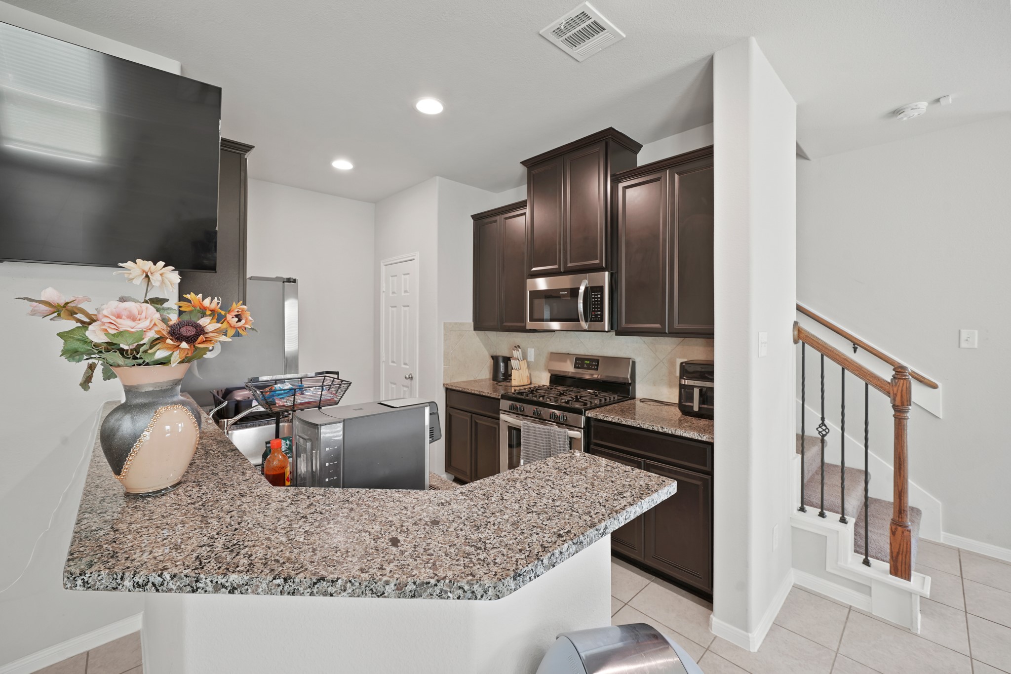 13303 Ardery Meadow Drive Houston, TX 77048 - Photo 10 of 33 a kitchen with counter top space appliances and cabinets