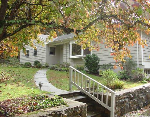 98 Cedar Road Wilton, CT 06897 - Photo 1 of 1 a balcony with trees in front of it