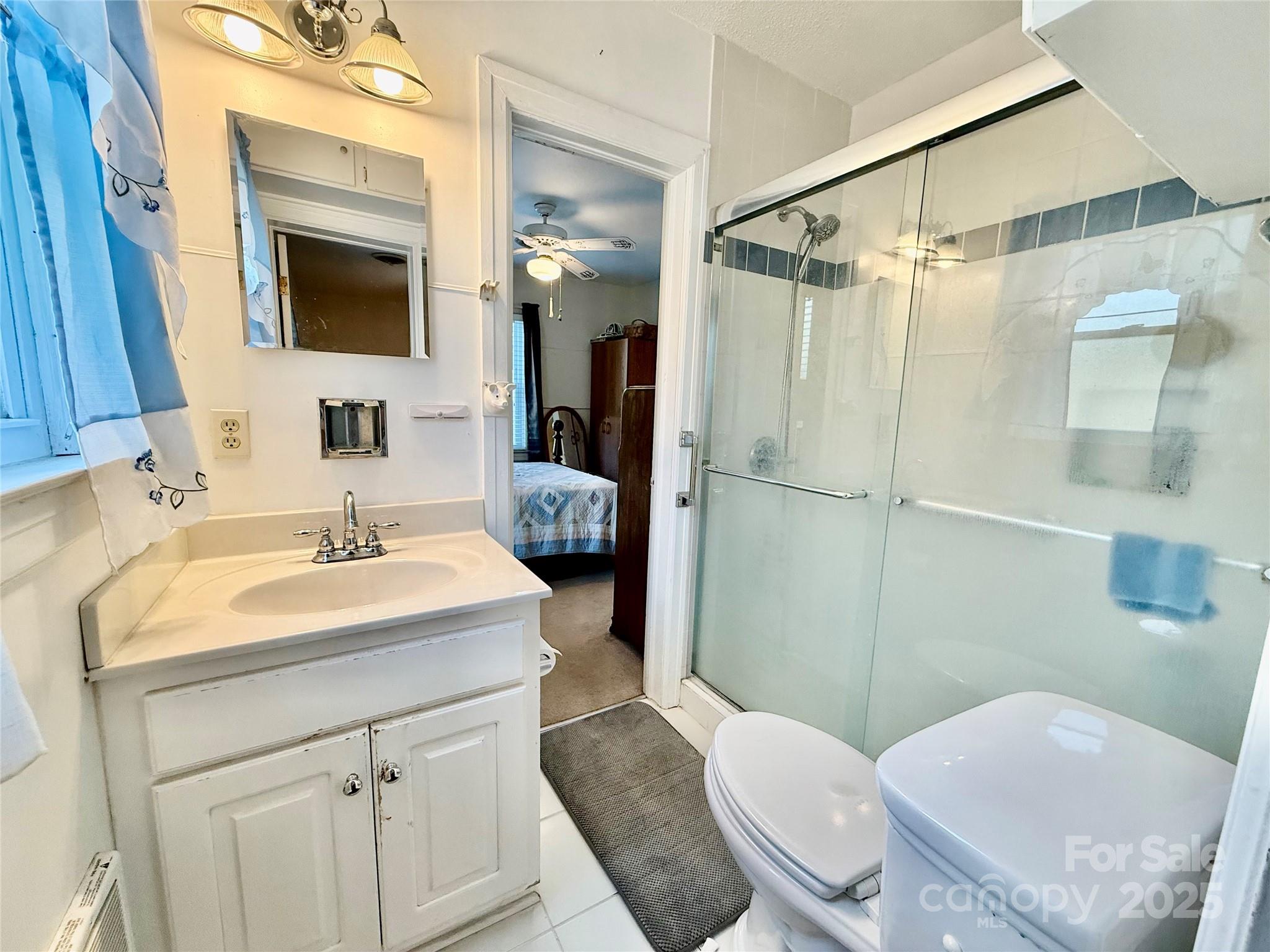 103 Magnolia Avenue Great Falls, SC 29055 - Photo 15 of 22 a bathroom with a sink toilet a mirror and shower