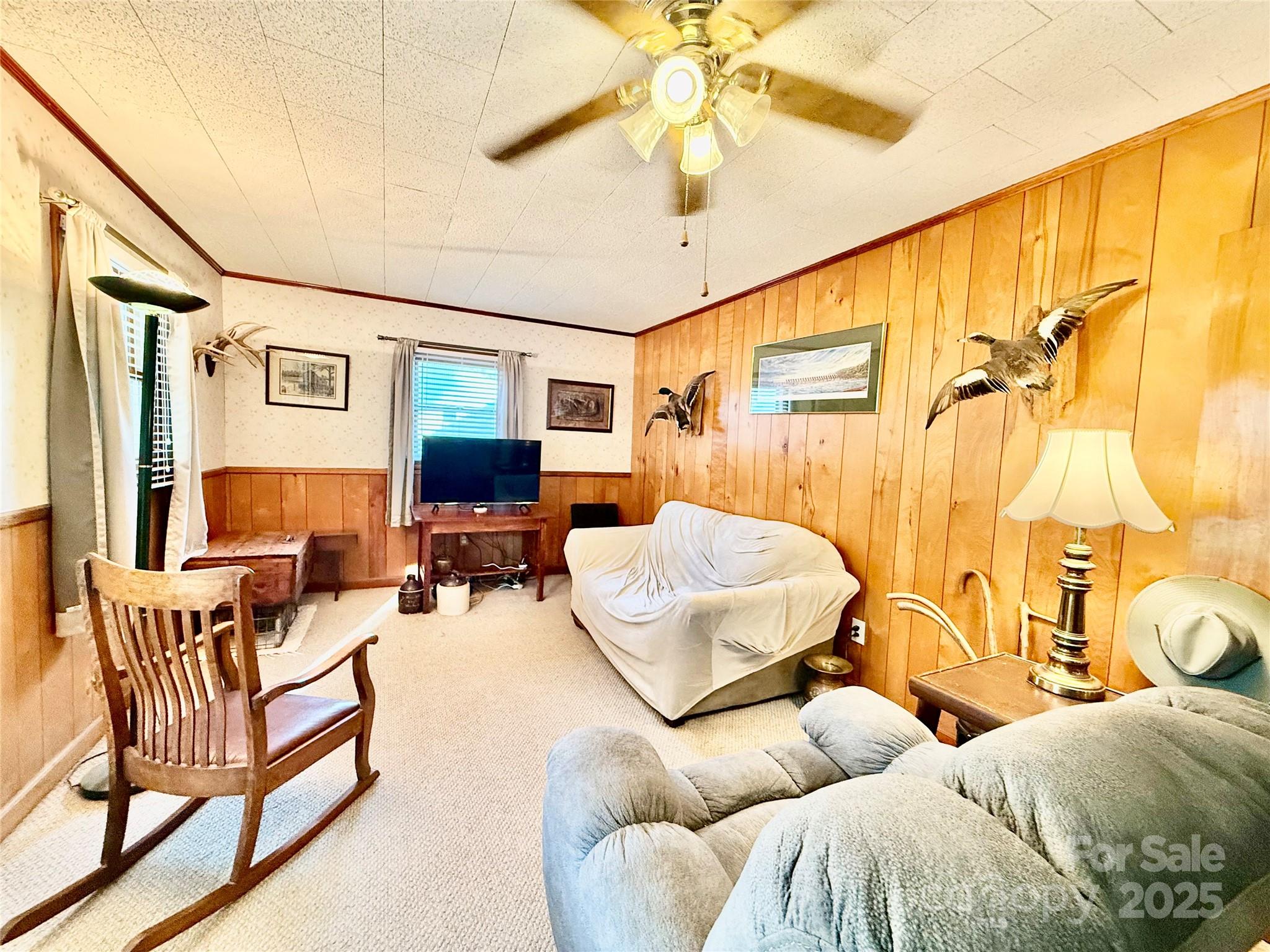 103 Magnolia Avenue Great Falls, SC 29055 - Photo 2 of 22 a living room with furniture and a flat screen tv