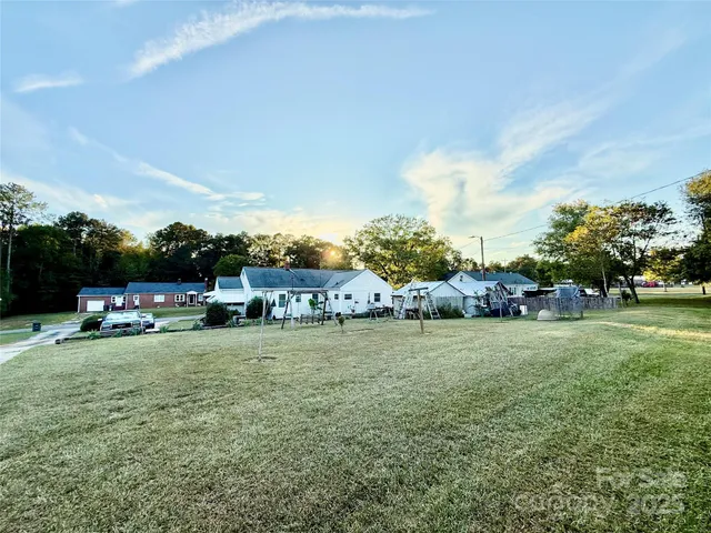 a view of a park with large trees