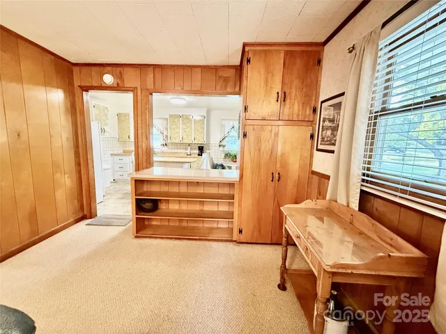 a bedroom with a bed and a table