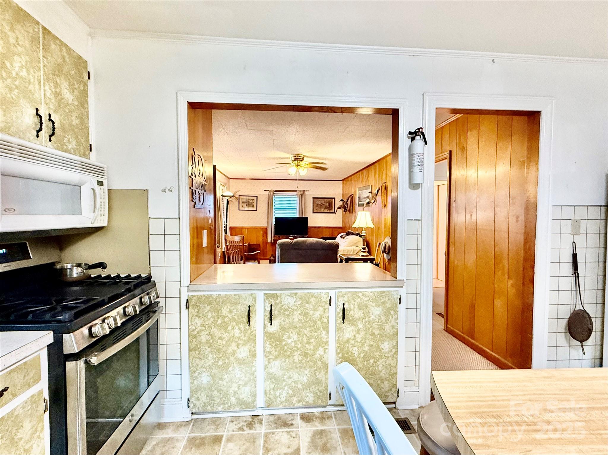 103 Magnolia Avenue Great Falls, SC 29055 - Photo 7 of 22 a kitchen with stainless steel appliances granite countertop a refrigerator and a stove