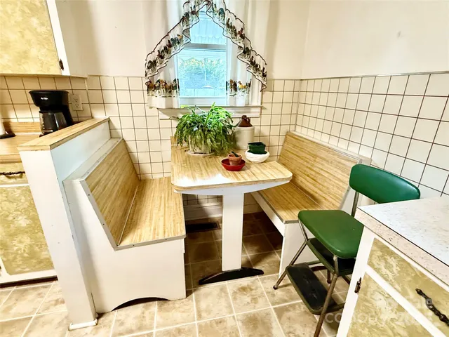 a view of a kitchen with a sink and living room