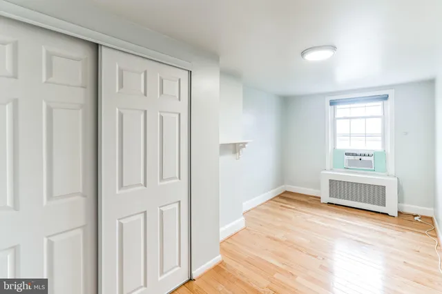 a view of a balcony with wooden benches