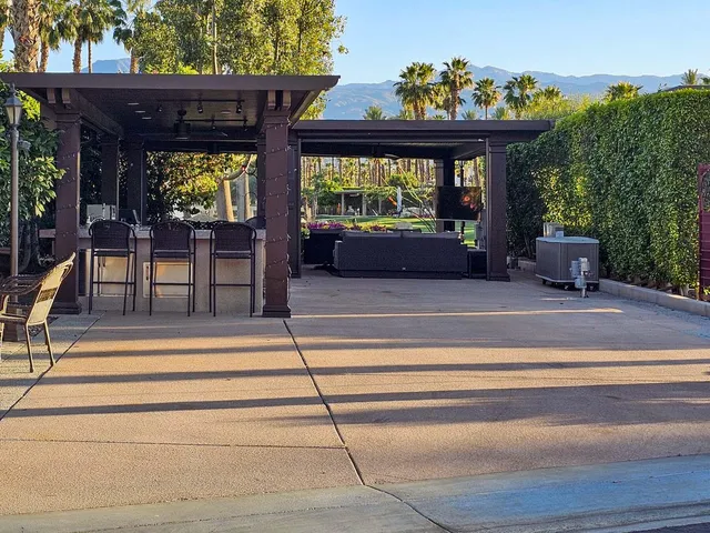 a living room filled with furniture and a potted plant